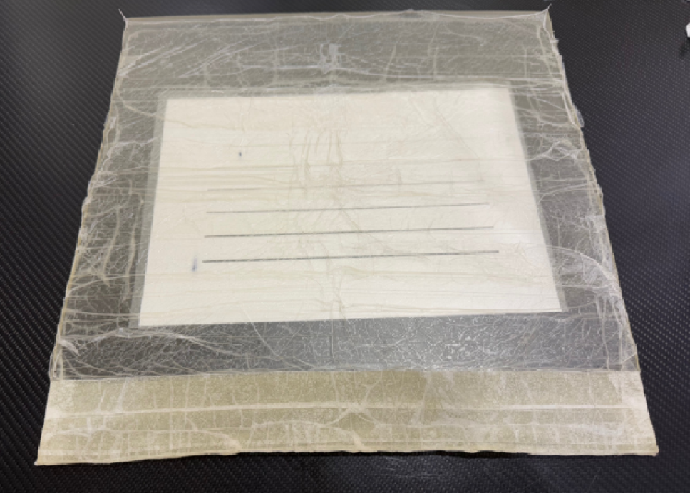 Encapsulated configuration of a flexible transparent adhesive bolus to improve surface conformity and skin safety in post-mastectomy radiation therapy